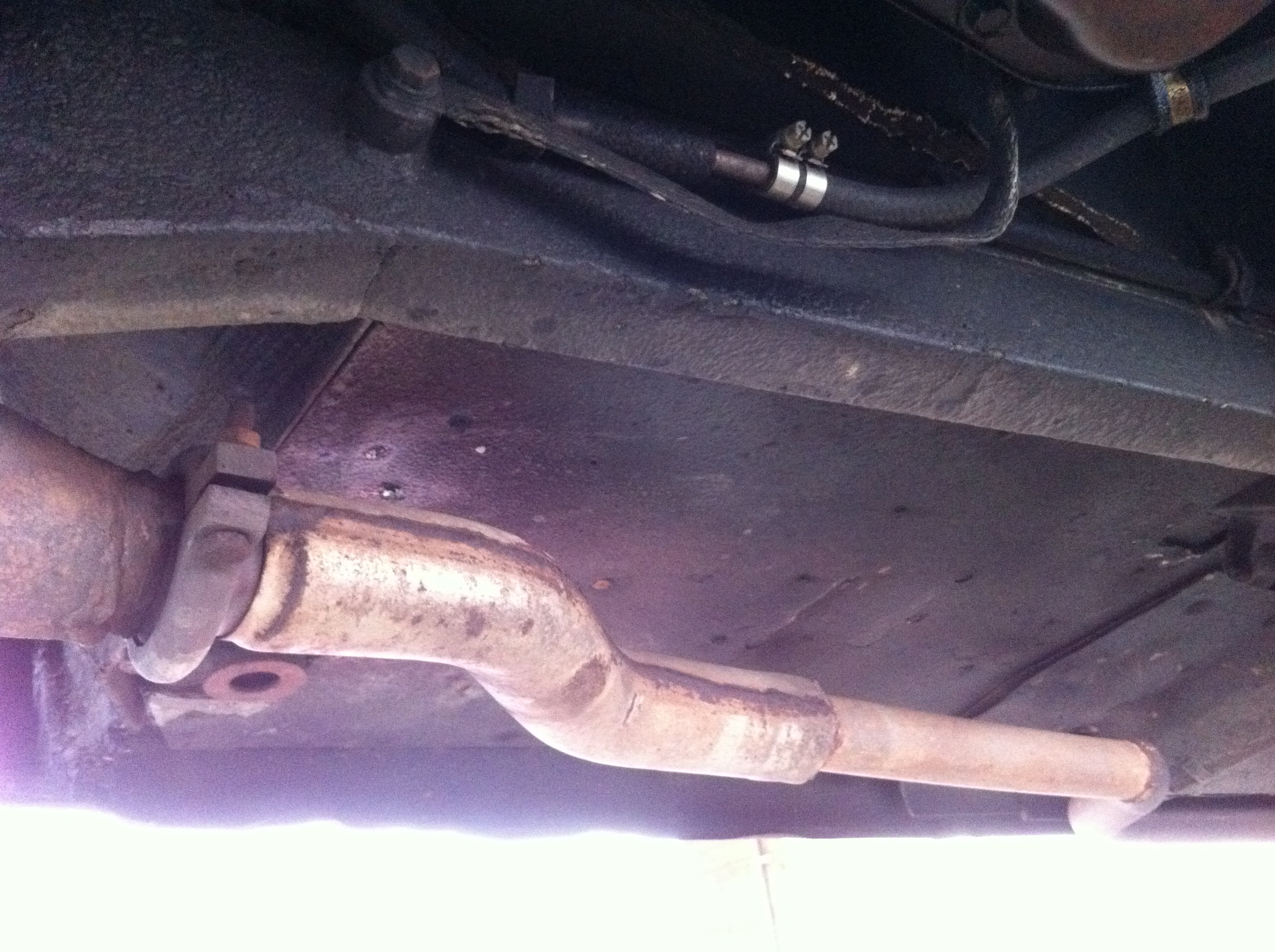 Catalytic converter replaced by straight pipe.