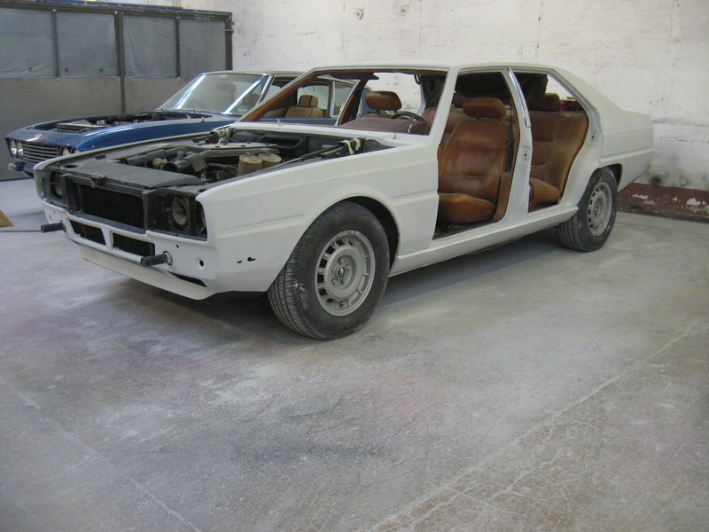 Looks a lot like a Jenson Interceptor in the background